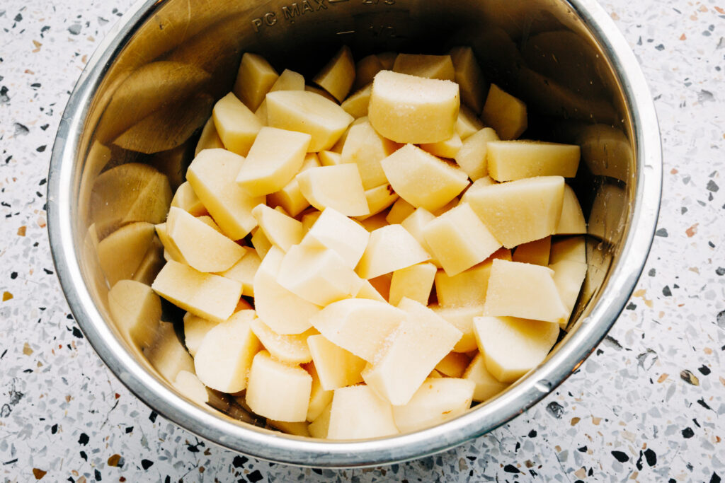 potatoes cubes up in an instant pot ready to be made into mashed potatoes