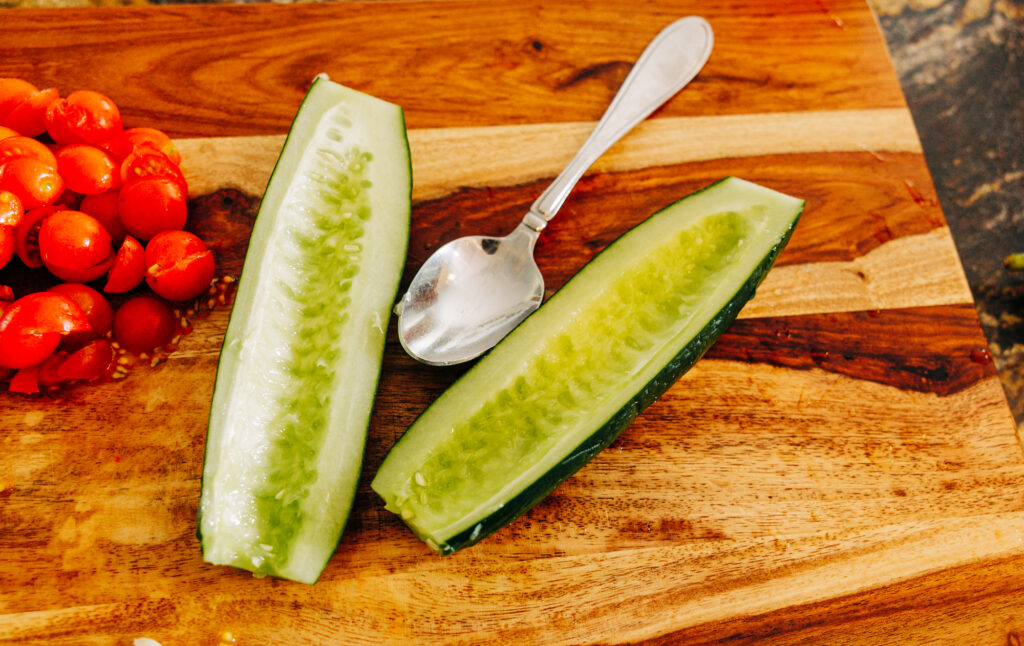 a garden cucumber cut it half with the seeds scooped out with a spoon