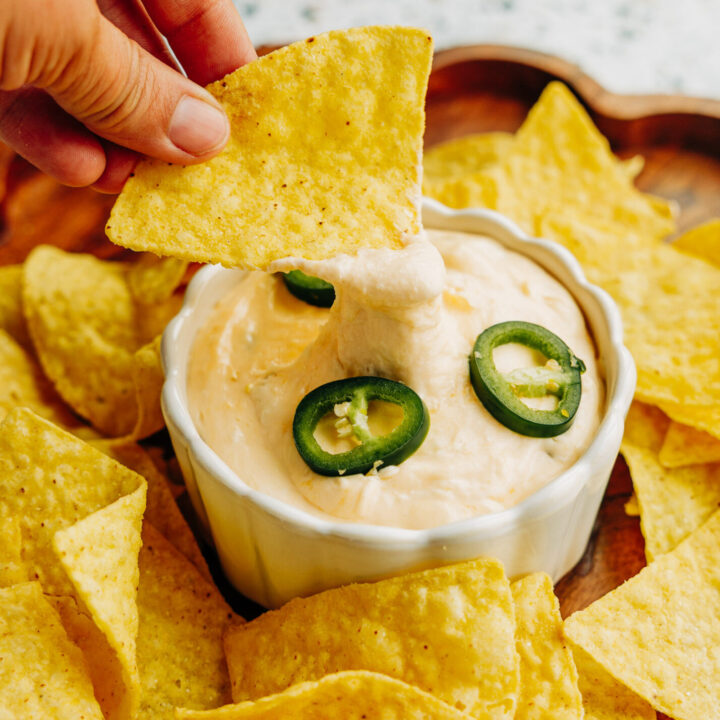a jalapeno popper dip garnished with sliced jalapeños. Served with tortilla chips.